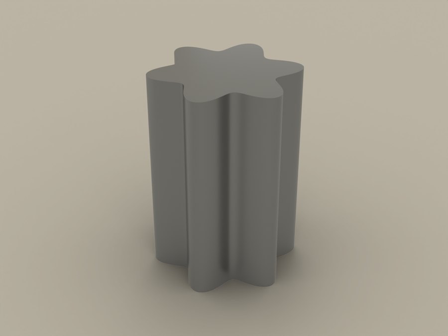 The waste slug the cut frees — a six-lobe post the full 20 mm thickness of the insert
